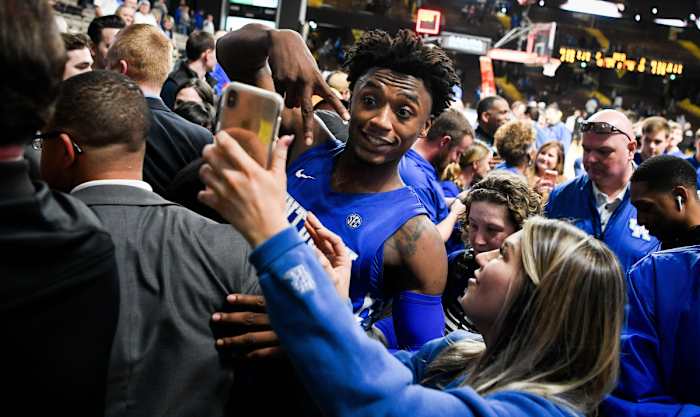Kentucky guard Ashton Hagans (0) celebrates with fans after defeating Vanderbilt at Memorial Gym in Nashville.
